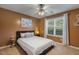 Cozy bedroom with carpet, ceiling fan, decorative accents and a large window at 131 Abacos Ct, Clayton, NC 27520