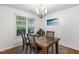 This dining room is a clean space with a beautiful view and elegant furnishings at 131 Abacos Ct, Clayton, NC 27520