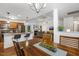 Open-concept with dining area flowing into a cozy living room and kitchen, perfect for modern living at 131 Abacos Ct, Clayton, NC 27520