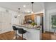 Bright kitchen with granite countertops, stainless steel appliances, and pendant lighting at 131 Abacos Ct, Clayton, NC 27520