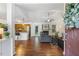Open-concept living area featuring hardwood floors, a fireplace, and views of the kitchen at 131 Abacos Ct, Clayton, NC 27520