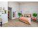 A cozy bedroom with neutral carpet and a high ceiling; decorated with plants and calming tones at 1363 Brown Velvet Ln, Apex, NC 27523