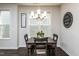 Cozy dining area featuring a dark wooden table and chairs with stylish decor at 1363 Brown Velvet Ln, Apex, NC 27523