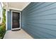 Inviting entrance with a black front door, siding and a concrete patio at 1363 Brown Velvet Ln, Apex, NC 27523