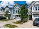 A view of multiple homes showcasing diverse architectural styles and manicured front yards at 1363 Brown Velvet Ln, Apex, NC 27523