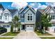 Charming two-story home with stone accents, an attached garage, and a well-manicured lawn at 1363 Brown Velvet Ln, Apex, NC 27523