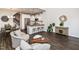 Open-concept living room flows into modern kitchen with island seating and stainless appliances at 1363 Brown Velvet Ln, Apex, NC 27523