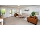 Bright living room with neutral tones, comfortable seating, and access to outdoor space at 1363 Brown Velvet Ln, Apex, NC 27523