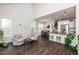 Open-concept living room flows into kitchen and dining area, with modern seating and finishes at 1363 Brown Velvet Ln, Apex, NC 27523