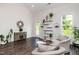 Bright living room with vaulted ceilings, modern decor, and dark wood-look flooring at 1363 Brown Velvet Ln, Apex, NC 27523