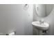 This powder room features a pedestal sink, modern fixtures, and is illuminated by natural light at 1363 Brown Velvet Ln, Apex, NC 27523