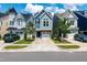 Street view of charming homes with garages, well-maintained lawns, and mature trees lining the street at 1363 Brown Velvet Ln, Apex, NC 27523
