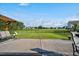 Scenic backyard view with a pergola swing and a well-maintained lawn and black fence at 1409 Sage Tree Dr, Zebulon, NC 27597