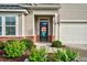 Close up of a beautifully landscaped home entrance with brick accents at 1409 Sage Tree Dr, Zebulon, NC 27597