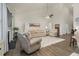 Spacious living room with high ceilings, fireplace, ceiling fan, and neutral-toned furniture at 1409 Sage Tree Dr, Zebulon, NC 27597