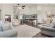 Open-concept living area showcasing a modern kitchen, cozy lounge, and dining space with vaulted ceilings at 1409 Sage Tree Dr, Zebulon, NC 27597