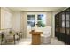 Stylish home office with a modern desk, comfortable seating, natural light, and elegant decor for a productive workspace at 1430 Jay Rd, Knightdale, NC 27545