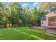 Backyard features a large, grassy area with patio and swing set at 15 Cole Creek Way, Franklinton, NC 27525