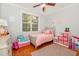 Bright bedroom with wood floors, a large window and a pink color scheme at 15 Cole Creek Way, Franklinton, NC 27525