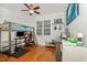 Bedroom with hardwood floors, a loft bed with a desk, and a ceiling fan at 15 Cole Creek Way, Franklinton, NC 27525