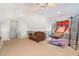 This bonus room features a tan sofa and a basketball hoop at 15 Cole Creek Way, Franklinton, NC 27525