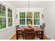 Charming dining nook with chandelier and views of the landscaped yard at 15 Cole Creek Way, Franklinton, NC 27525