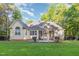 Back exterior view of home with patio and fenced yard at 15 Cole Creek Way, Franklinton, NC 27525