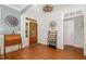 Elegant foyer featuring hardwood floors, wooden furniture, and a decorative chandelier at 15 Cole Creek Way, Franklinton, NC 27525