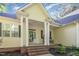 Welcoming front porch with brick steps, columns, and space for rocking chairs at 15 Cole Creek Way, Franklinton, NC 27525