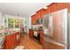 Spacious kitchen with stainless steel appliances and a view of the dining nook at 15 Cole Creek Way, Franklinton, NC 27525