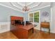 Home office featuring hardwood floors, large desk, and classic chandelier at 15 Cole Creek Way, Franklinton, NC 27525