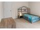 bedroom with stylish bedframe, soft carpet, and natural light from the window at 161 Jacob St, Holly Springs, NC 27540