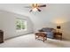 Bedroom featuring neutral walls and carpet, ceiling fan and couch, and natural lighting at 161 Jacob St, Holly Springs, NC 27540