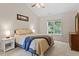Cozy bedroom with vaulted ceilings, plush carpet, and natural light from the window at 161 Jacob St, Holly Springs, NC 27540