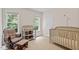 Cozy Bedroom with a crib, glider, and changing table near windows for great lighting at 161 Jacob St, Holly Springs, NC 27540