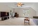 Large bedroom with neutral walls and carpets, ceiling fan and ample natural light from the windows at 161 Jacob St, Holly Springs, NC 27540