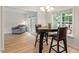 Charming breakfast nook with views of the yard and access to the living room through french doors at 161 Jacob St, Holly Springs, NC 27540