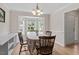 Bright dining room featuring a bay window and elegant decor, perfect for entertaining guests and Gathering at 161 Jacob St, Holly Springs, NC 27540