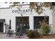 Charming coffee roastery with outdoor seating and a modern black-and-white facade at 161 Jacob St, Holly Springs, NC 27540