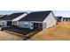 Aerial view of the home showing the backyard with screened porch and black metal fence at 1626 Plover Cir, Fuquay Varina, NC 27526