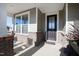 Welcoming front entrance with a glass-paneled door, brick accents, and a covered porch area at 1626 Plover Cir, Fuquay Varina, NC 27526