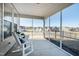 Comfortable screened porch featuring rocking chairs and neighborhood view at 1626 Plover Cir, Fuquay Varina, NC 27526