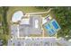 A top-down view of a community pool, clubhouse, parking, tennis courts, and common areas at 1633 Hillstar St, Fuquay Varina, NC 27526