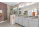 Bright bathroom featuring a glass shower, double vanity, and granite countertops at 1633 Hillstar St, Fuquay Varina, NC 27526