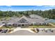 A beautiful community clubhouse with ample parking, flags and a view of the water at 1633 Hillstar St, Fuquay Varina, NC 27526