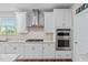 Stylish kitchen featuring stainless steel appliances, granite countertops, and ample cabinet space at 1633 Hillstar St, Fuquay Varina, NC 27526