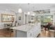 Open-concept kitchen with granite countertops, stainless steel appliances, and a large island at 1633 Hillstar St, Fuquay Varina, NC 27526