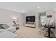 Bright living room with desk, TV, and comfy couch at 1633 Hillstar St, Fuquay Varina, NC 27526