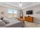 Main bedroom with a trey ceiling, closet and ample natural light at 1633 Hillstar St, Fuquay Varina, NC 27526