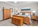 Main bedroom features a trey ceiling, natural lighting, and luxury furnishing at 1633 Hillstar St, Fuquay Varina, NC 27526